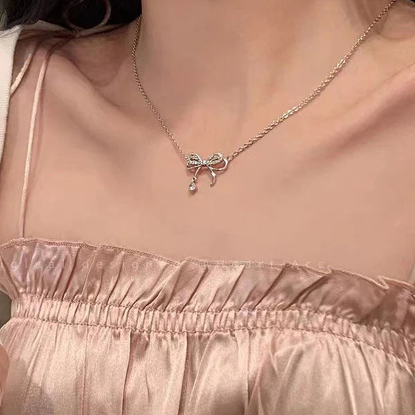 Bow Theory — Rose Gold Ribbon Necklace with CZ Drop NVR-0540