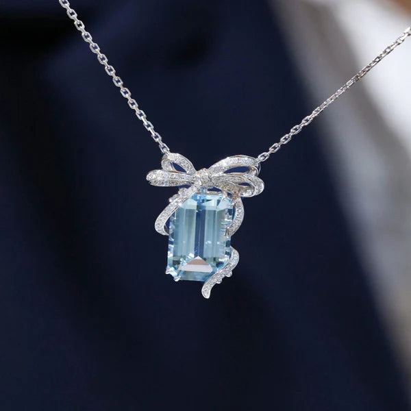 Cinderella's Secret — The Blue Topaz Bow Necklace NVR-0505