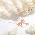 Bow Theory — Rose Gold Ribbon Necklace with CZ Drop NVR-0540