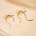 The Long Bow — Gold Snake Chain Ribbon Earrings NVR-0549