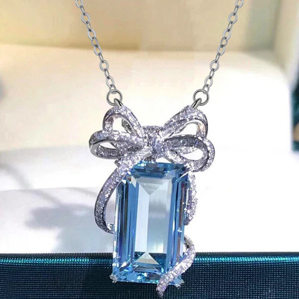 Cinderella's Secret — The Blue Topaz Bow Necklace NVR-0505